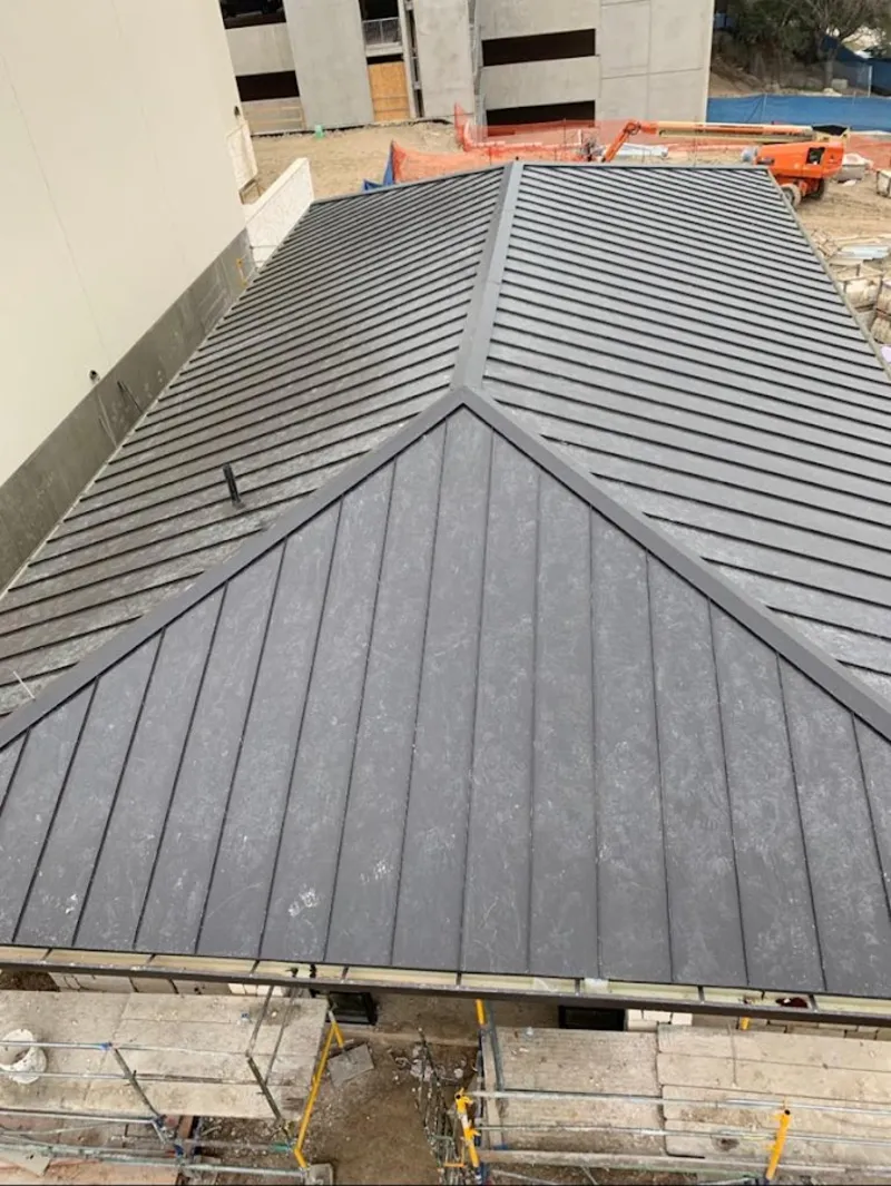 Commercial metal roof construction with crane equipment in Stuttgart
