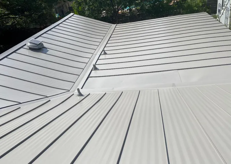 Solar attic fan installed on a metal roof for Roof Ventilation in Stuttgart